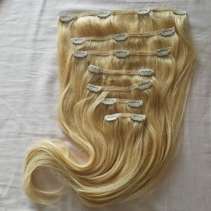 Blonde human hair extensions